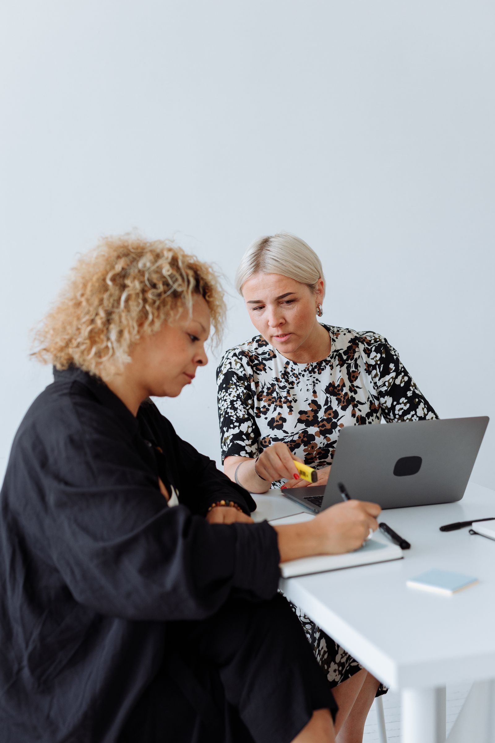 Two people reviewing a plan together