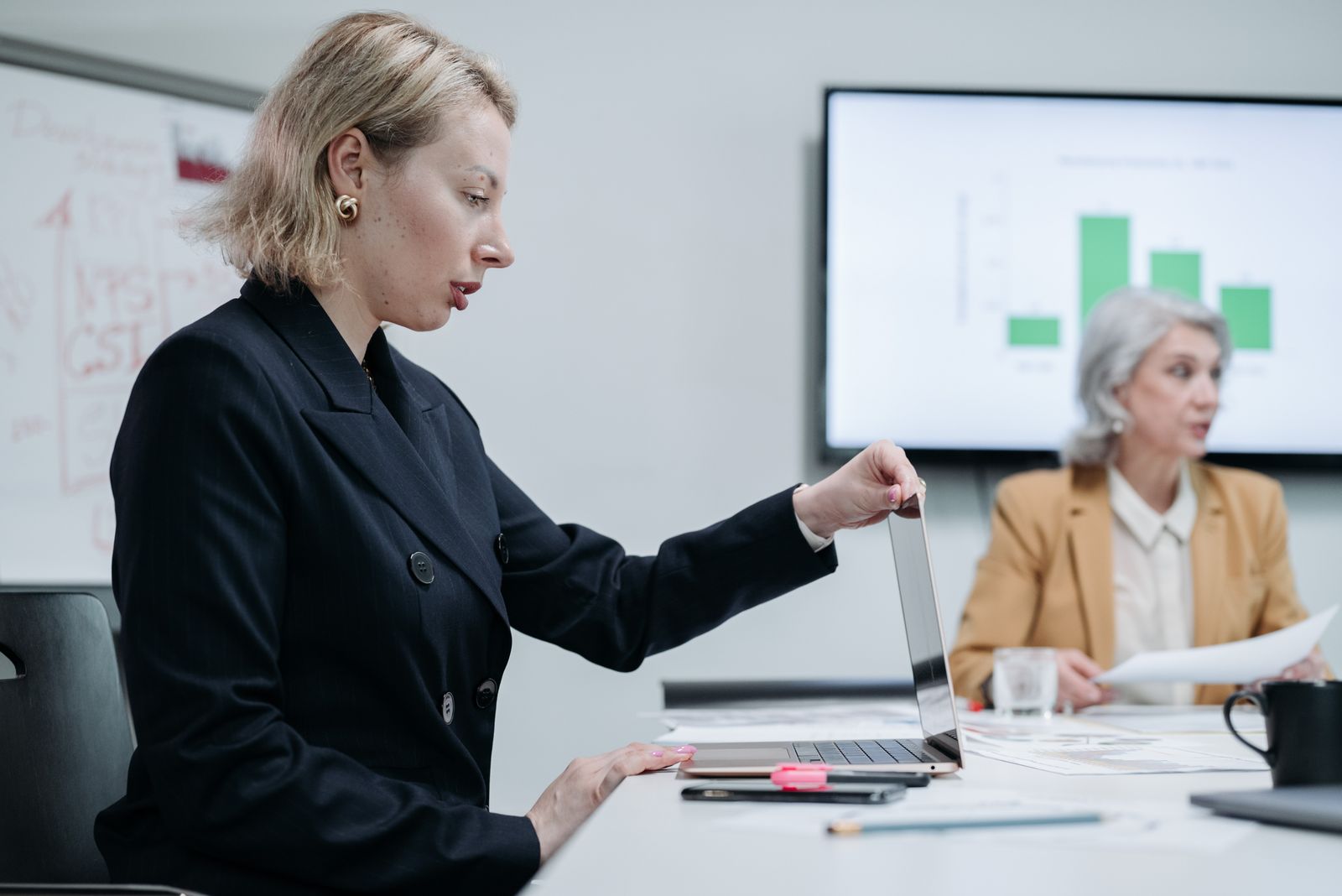 Two senior leaders reviewing data together