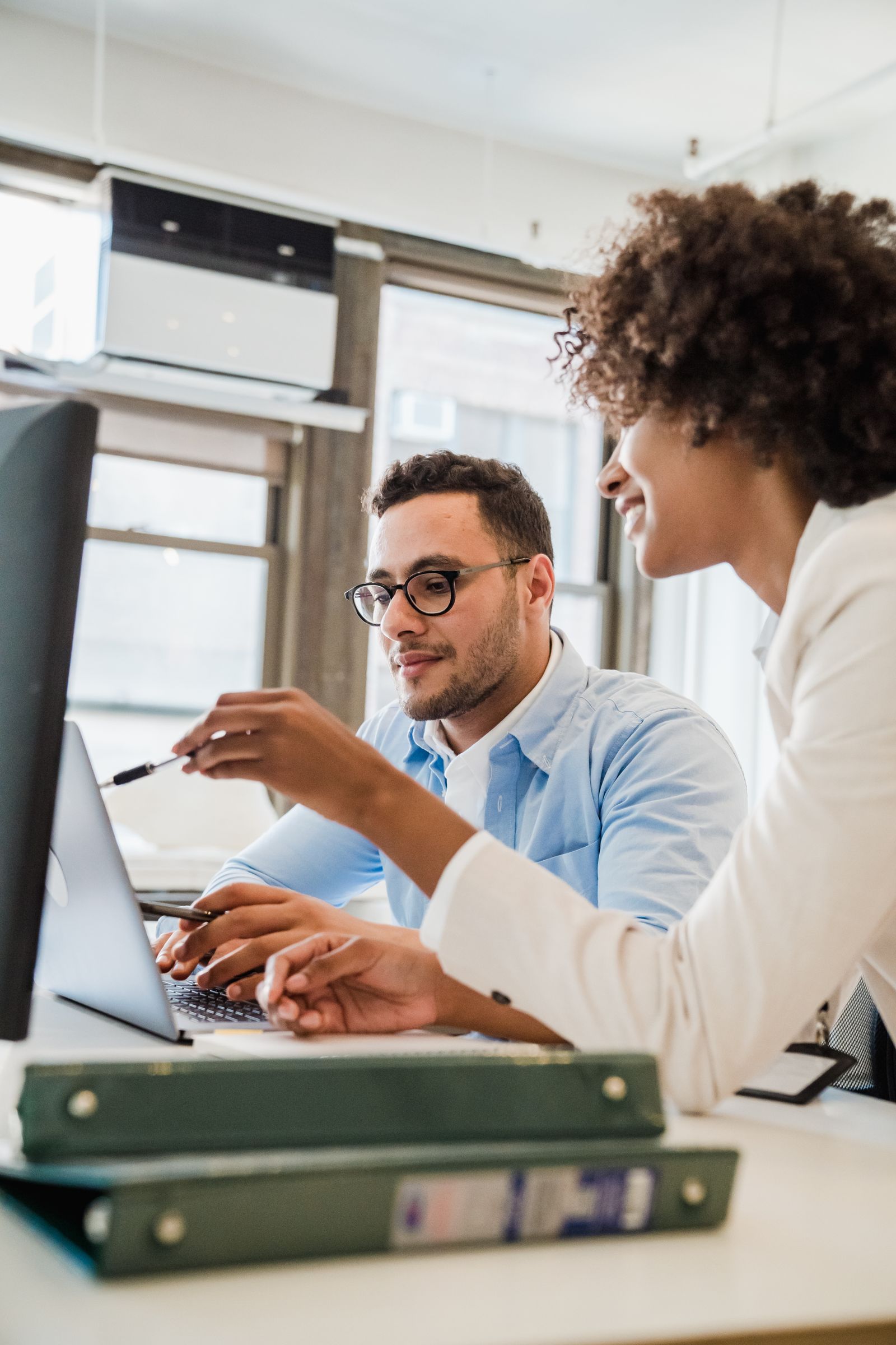 Engineers pair-working at one screen