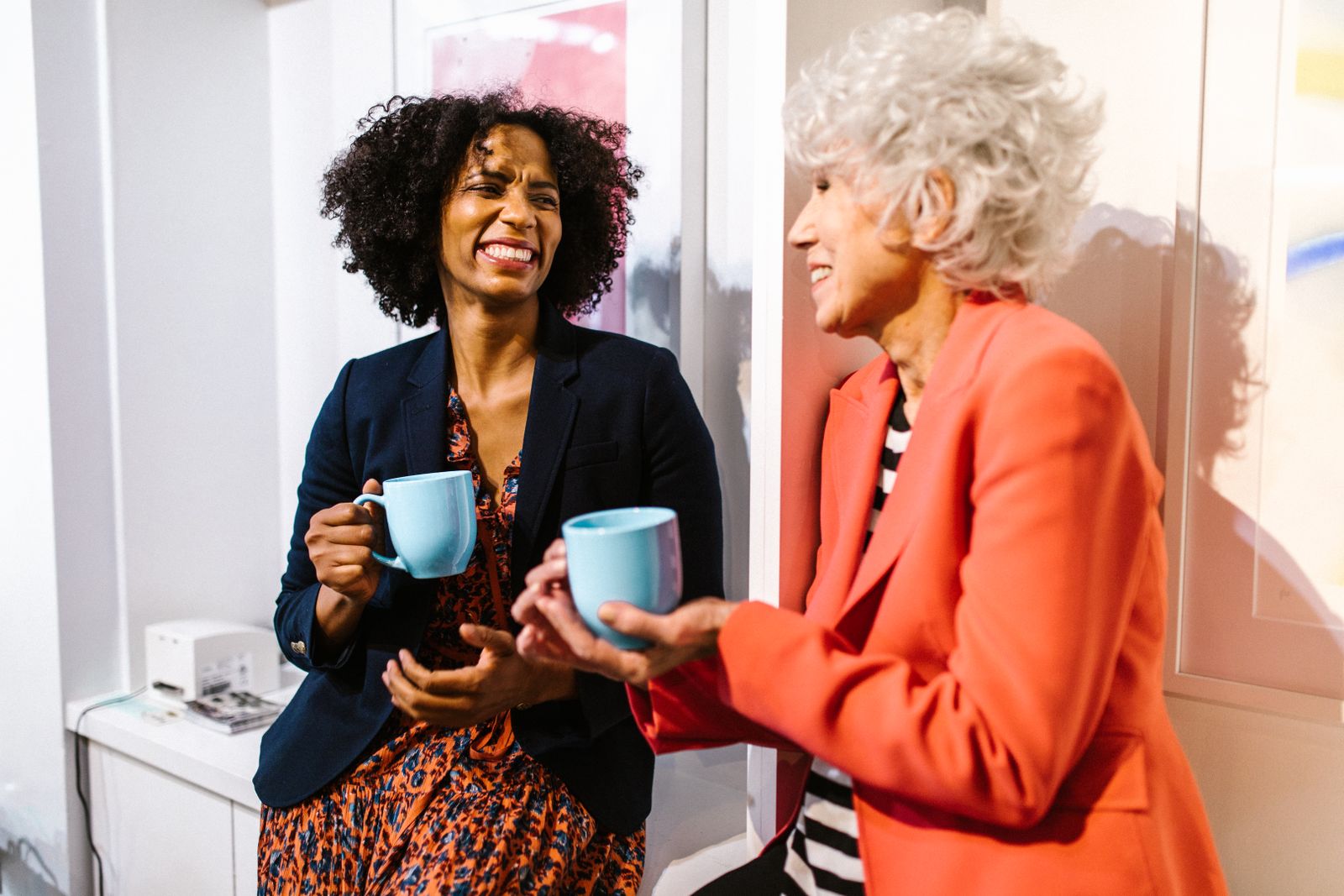 Two colleagues catching up over coffee