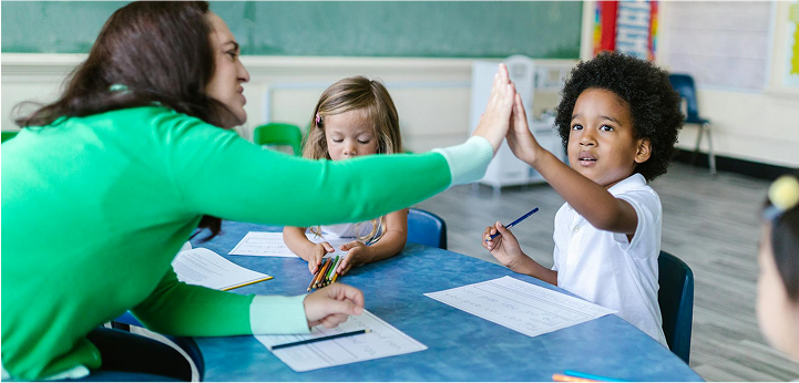 BCBA high-fiving a client