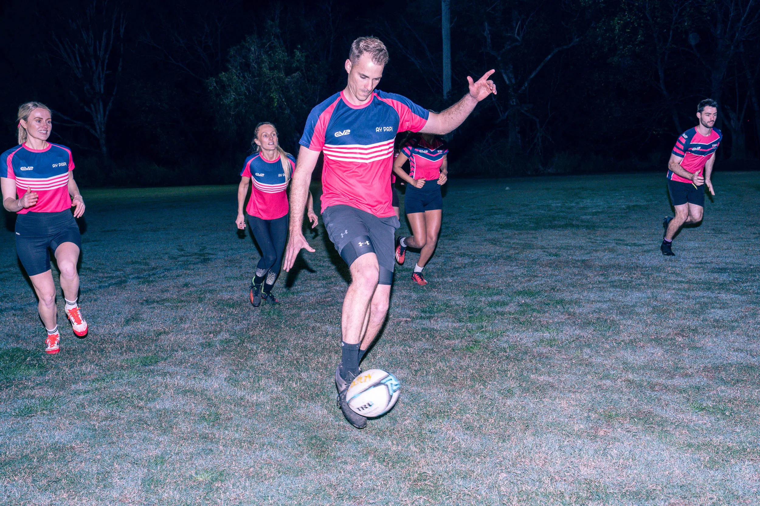 Person kicking ball TRL social touch football game