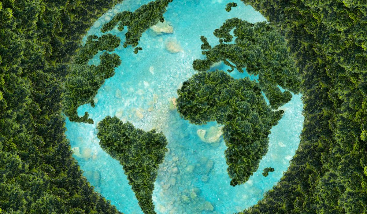 Earth map made of green forest against blue water background