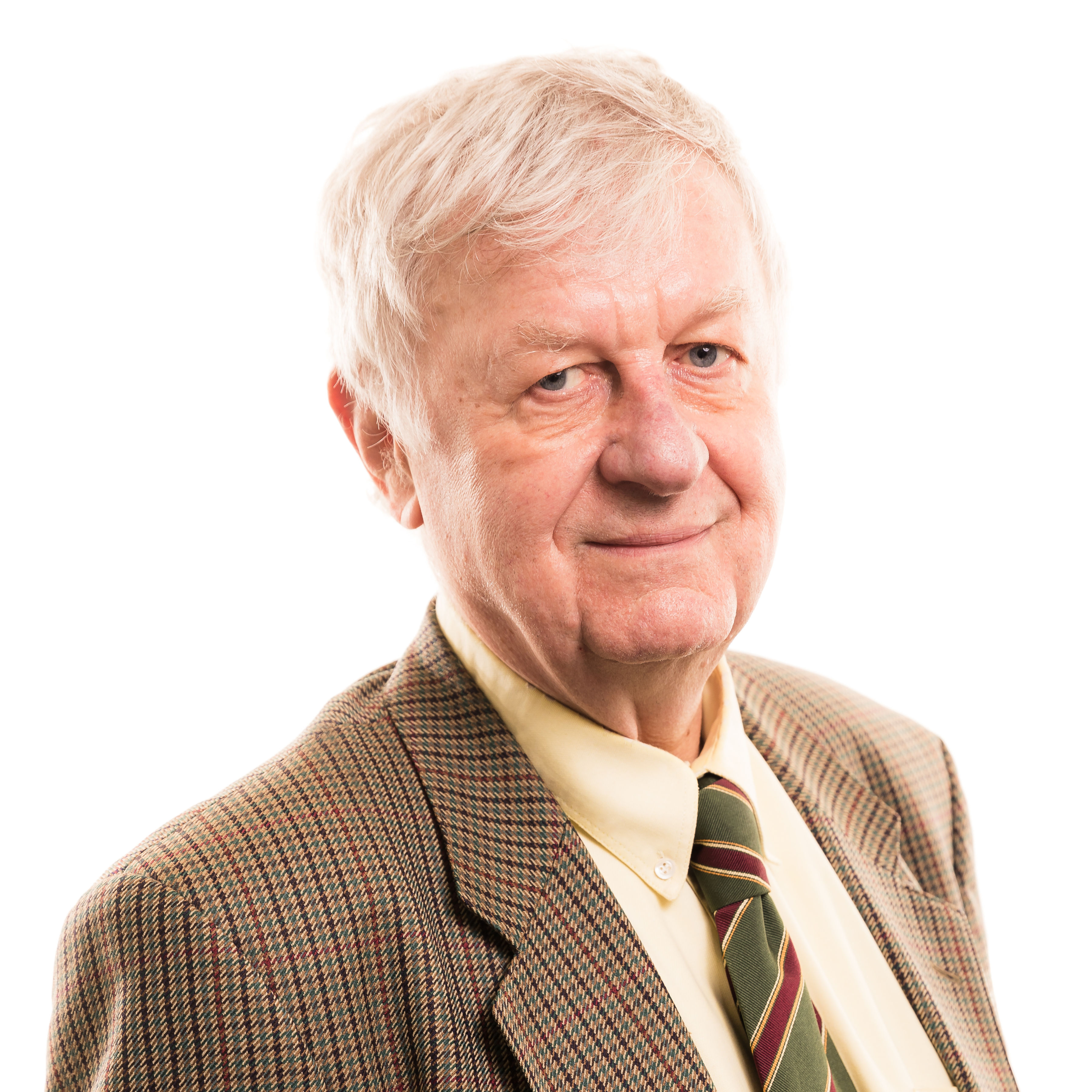 Elderly gentleman in tweed jacket and striped tie, smiling warmly