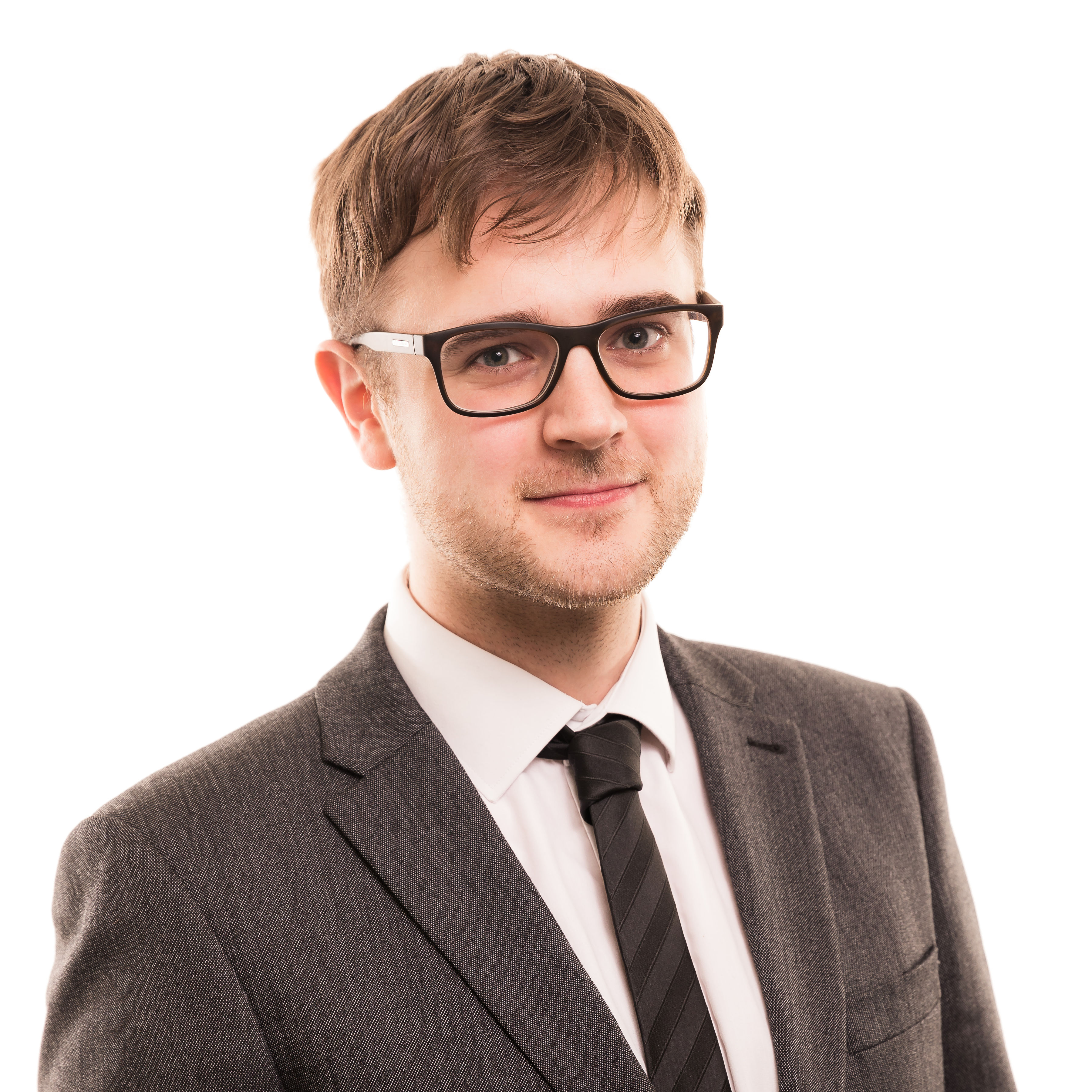 Professional man in glasses and gray suit smiling confidently