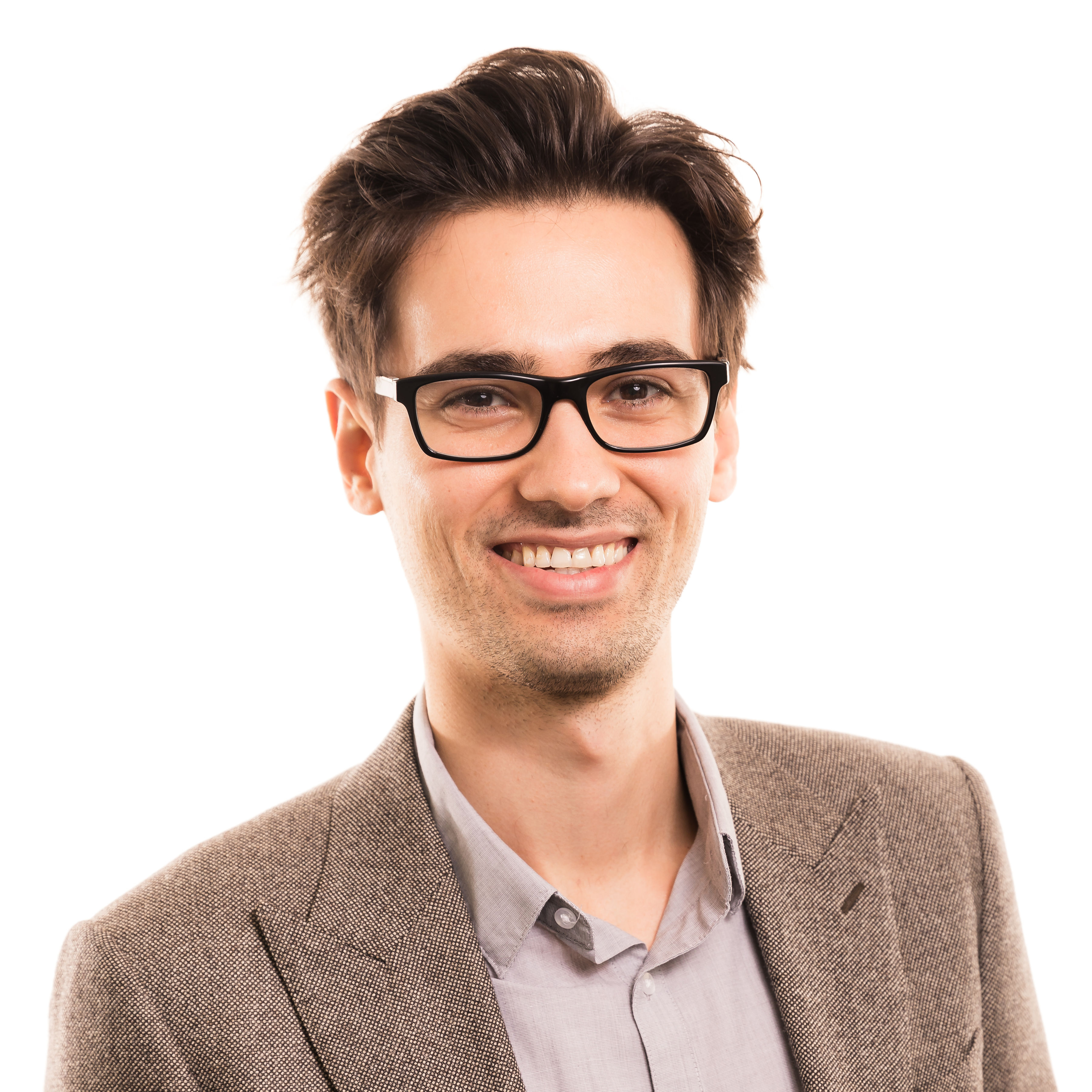 Smiling professional wearing glasses and brown tweed blazer