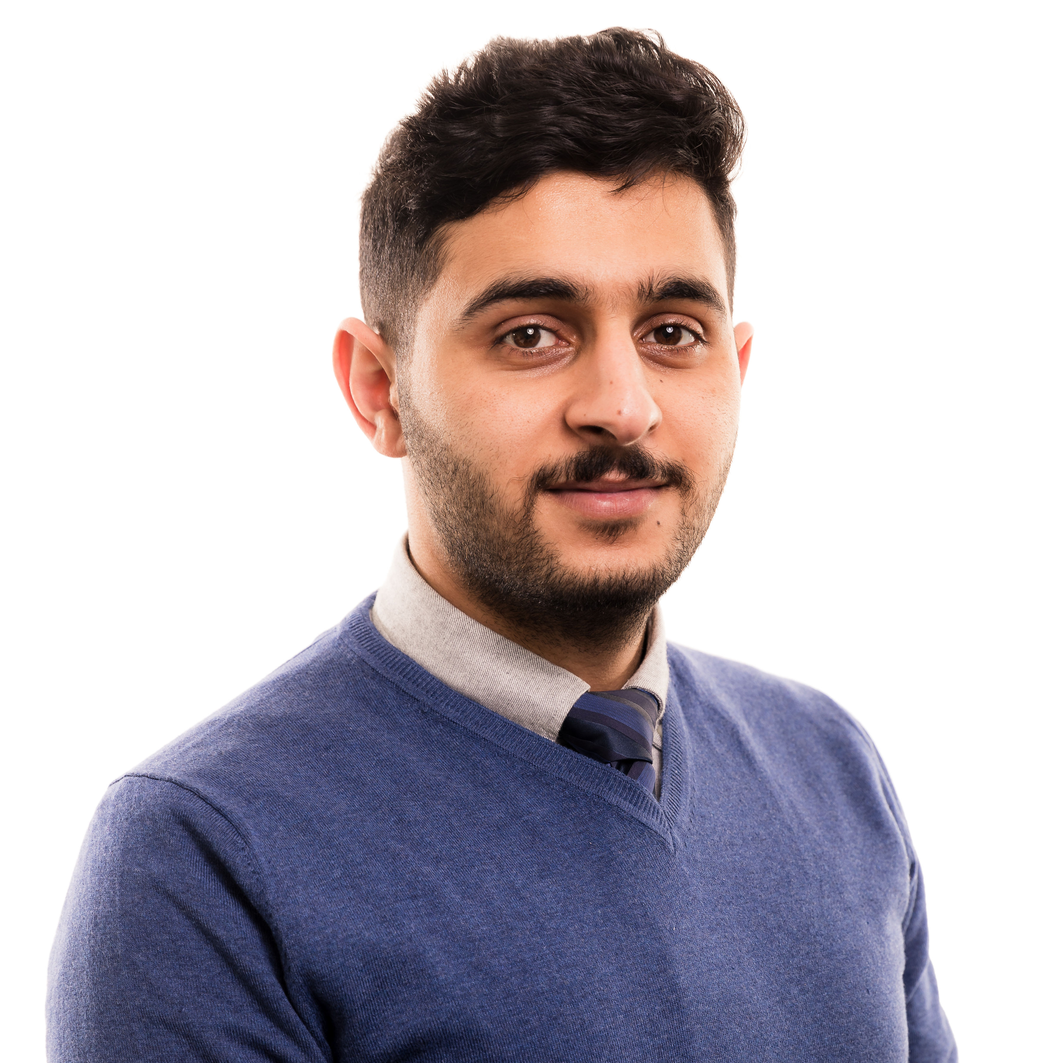 Professional portrait of a person in blue sweater and collared shirt