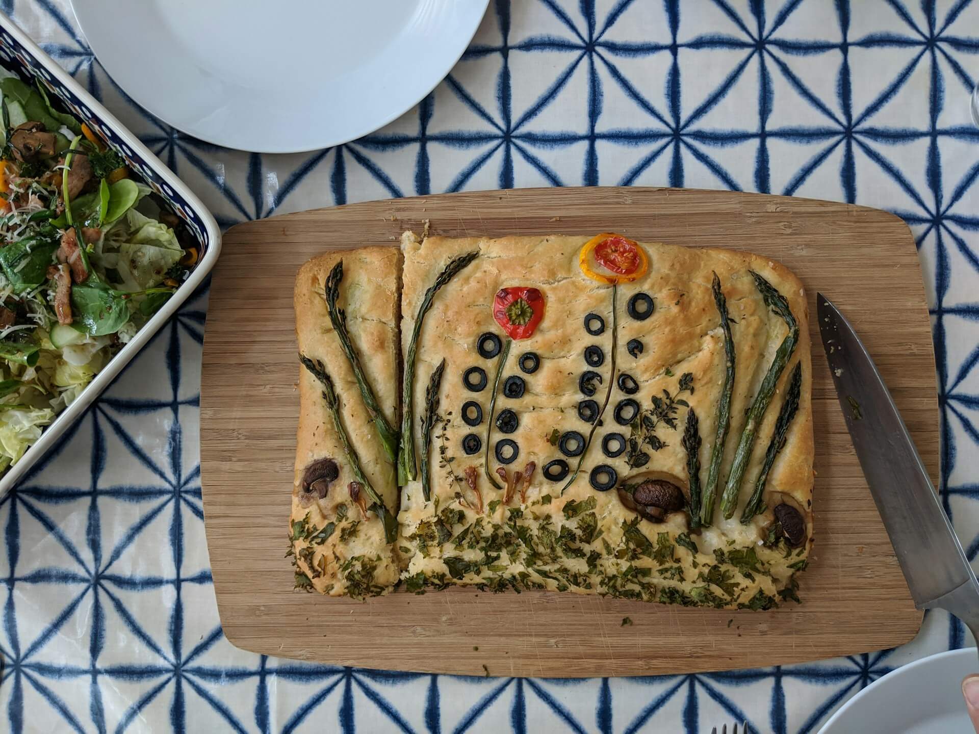 Focaccia bread with edible art showing flowers on top
