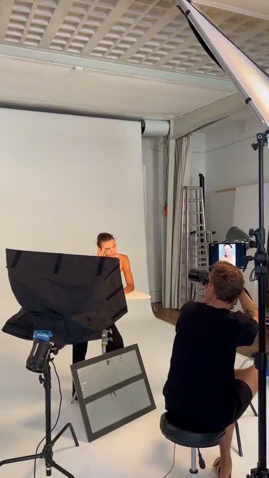 Wide view of the set with frame, beauty dish and camera