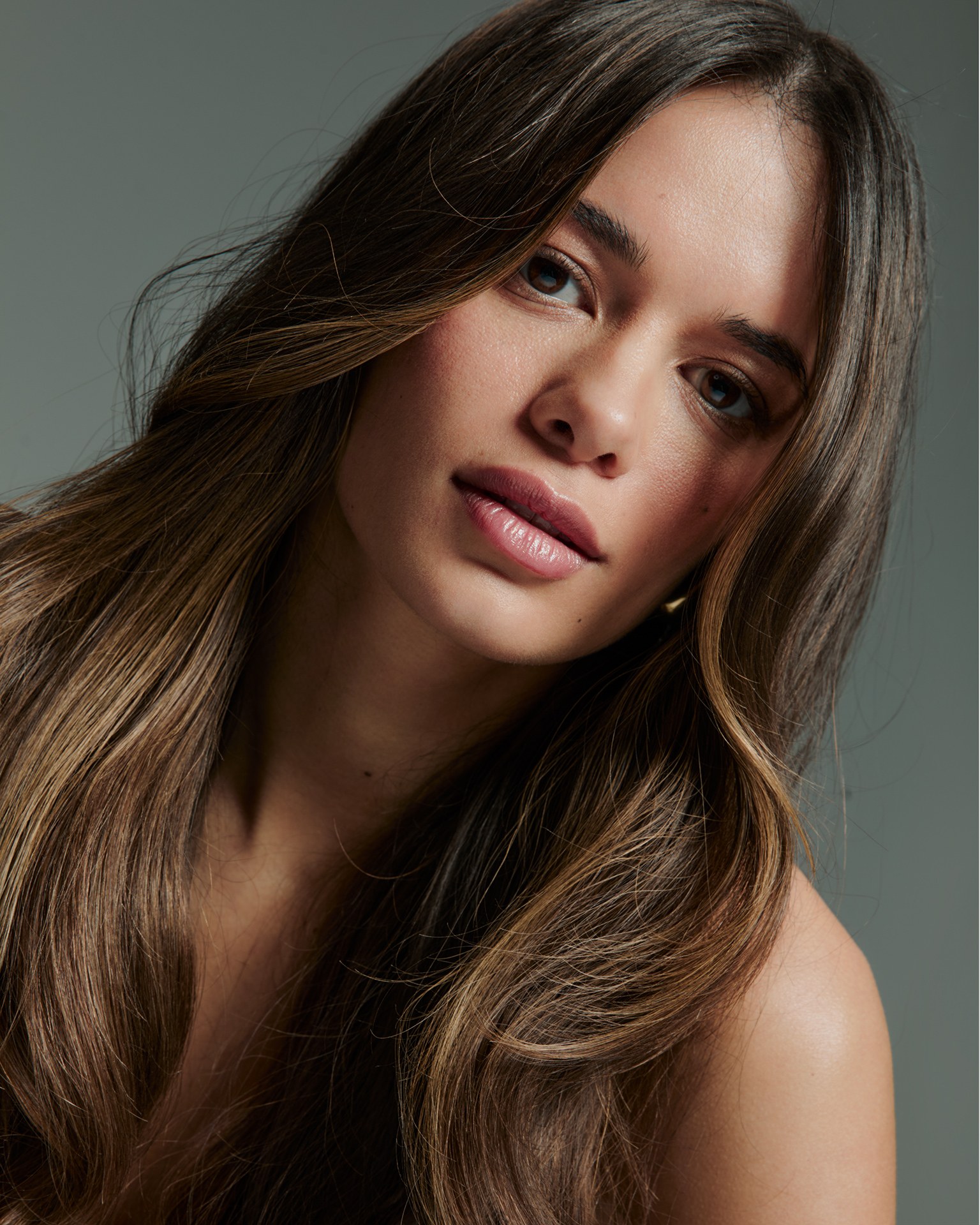The finished portrait with even skin, refined hair colour and clear eyes, as published
