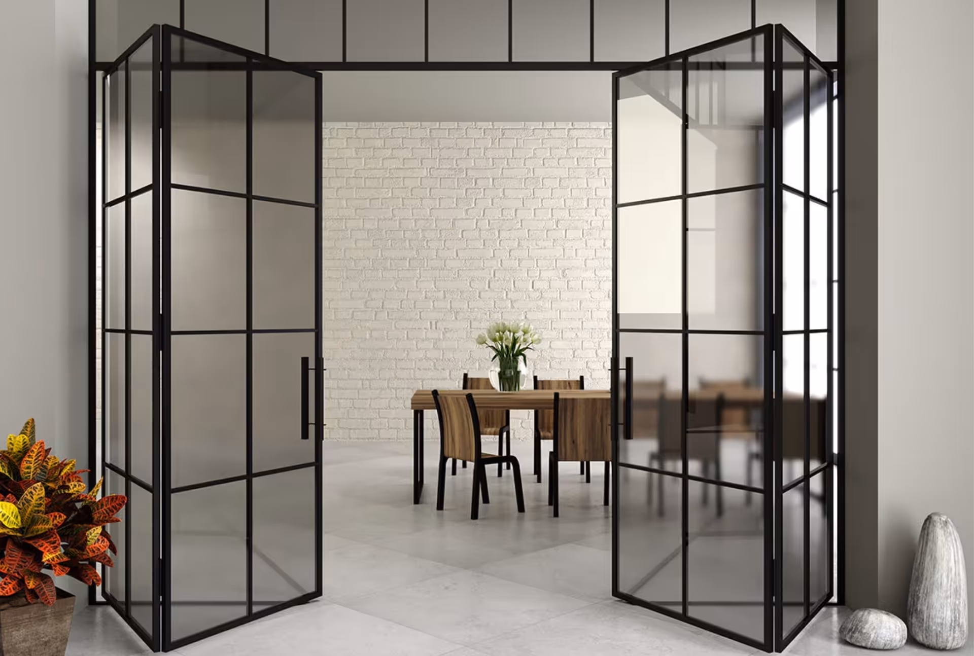 Black heritage-style glass doors opening into a dining area with white brick wall and wooden furniture.