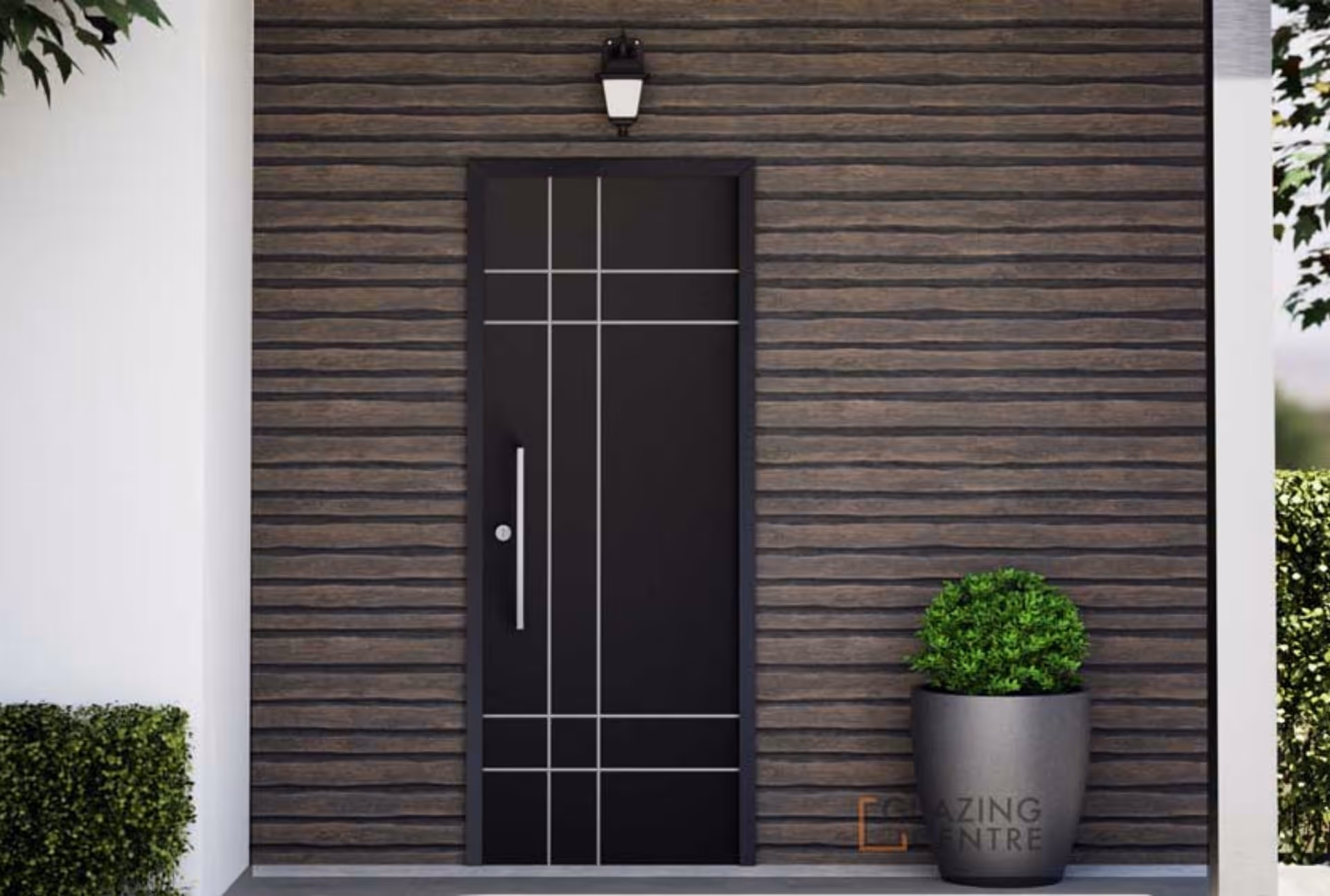 Black aluminum door with white geometric lines, wooden slat wall, and potted plant.