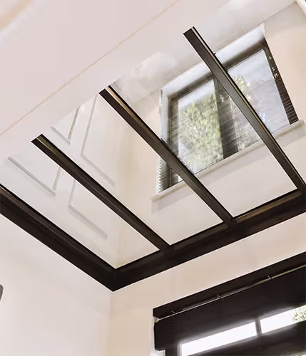Elegant conservatory with glass roof and modern frames designed by trusted upvc doors and windows suppliers for homes