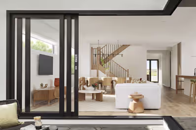 Modern aluminium sliding patio doors with sleek glass panels, enhancing indoor-outdoor living in contemporary homes.