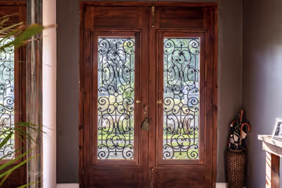 Blue heritage aluminium door with a white window, showcasing modern design and durability for UK homes.