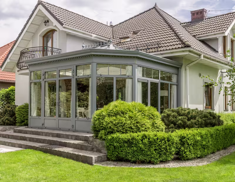 Bright living room featuring a large sliding glass door, showcasing modern design by top window and door manufacturers.