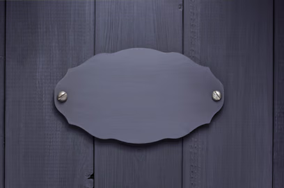 Wooden door featuring a brass letterplate, showcasing modern composite doors by leading UK manufacturers.