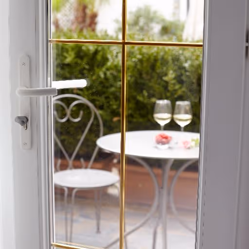 White uPVC front door with decorative glass panels and matching side and top windows