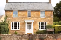 Large stone wall reflecting Georgian and Victorian properties, enhancing architectural heritage