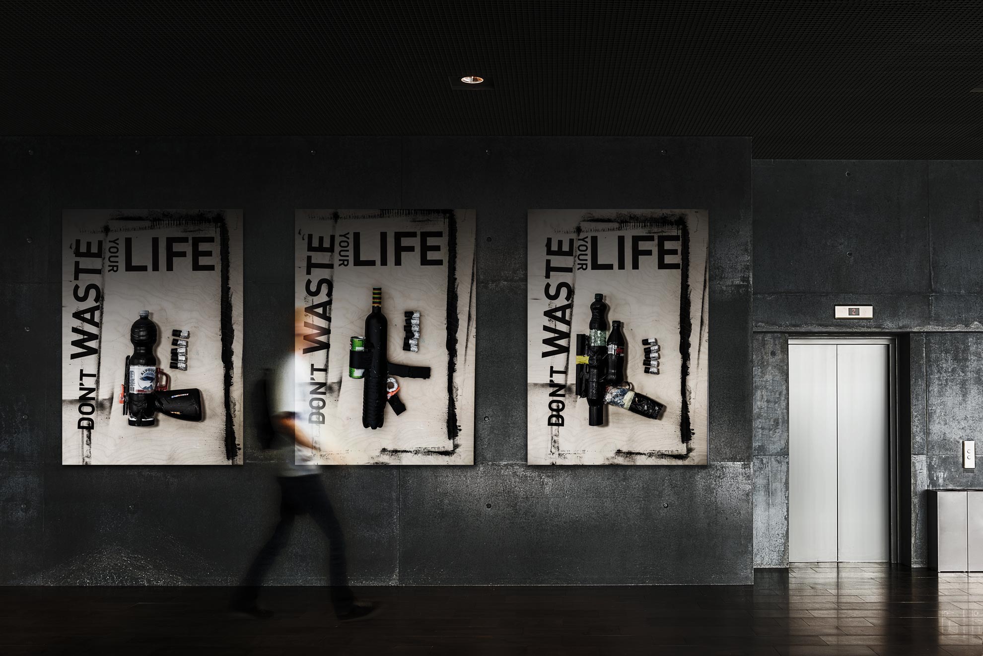 Series of 3 posters hanging on a wall, showing different weapons made of plastic waste and dyed with acrylic paint .