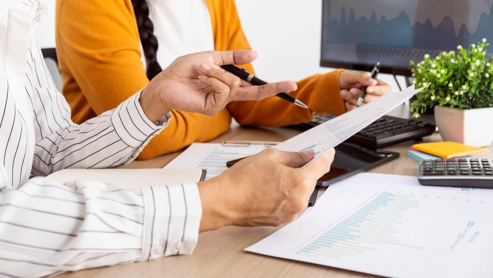 Women looking over business paperwork