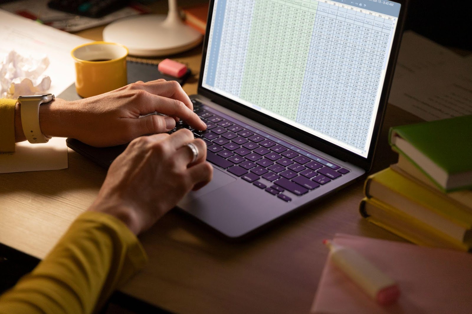 Person working on formulas in Excel