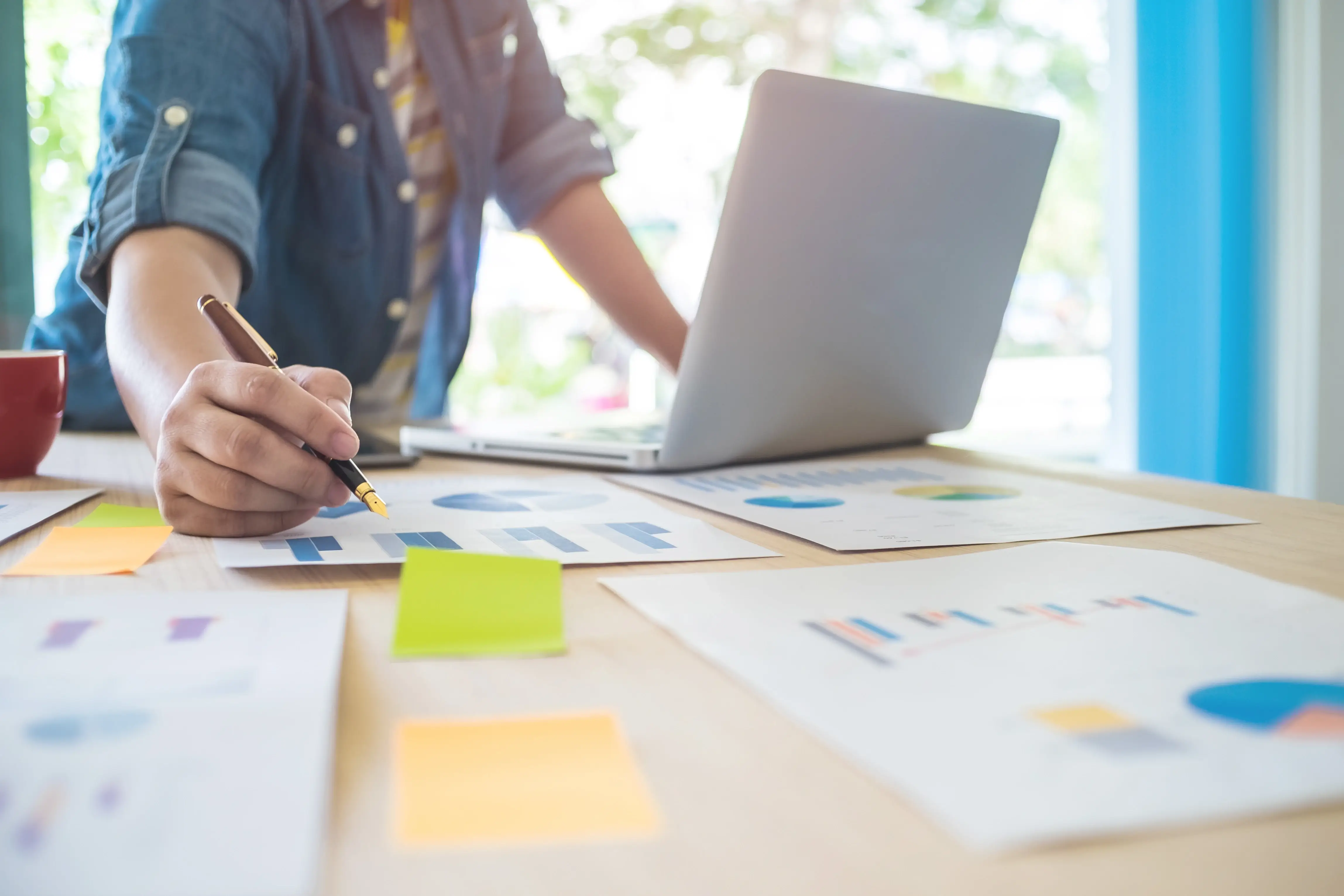 Businesswoman reviewing documents on her desk