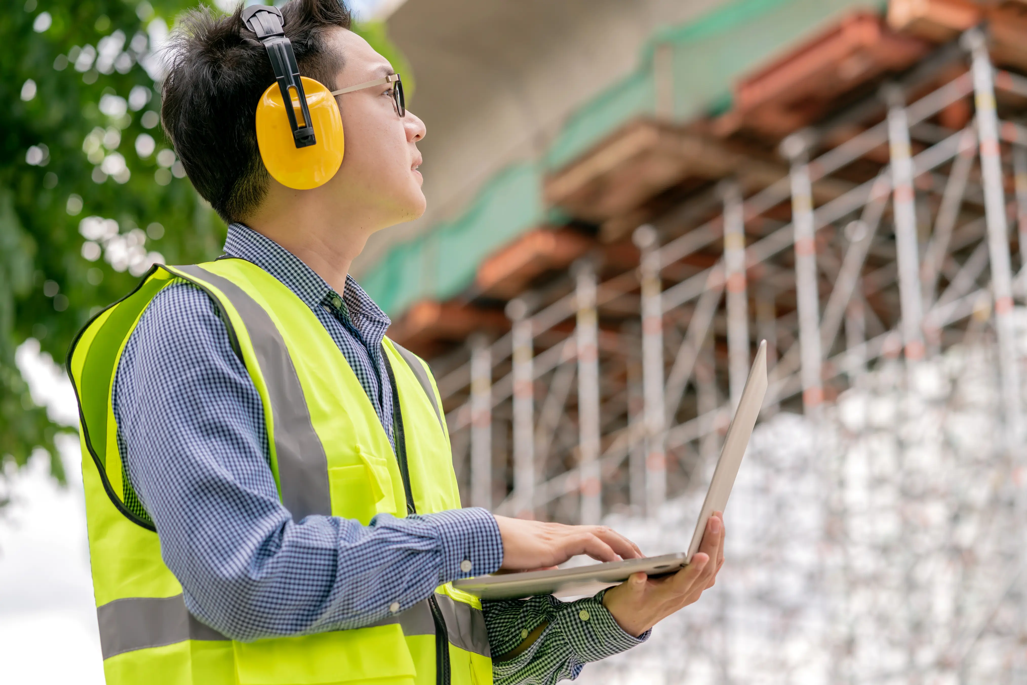 Field service professional using their laptop in the job site.