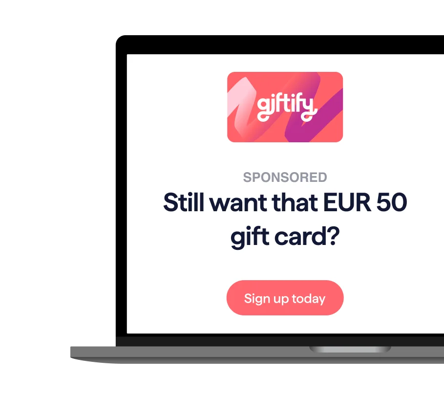 A digital advertisement for Giftify displayed on a laptop screen. The ad features the Giftify logo and the text, "Still want that EUR 50 gift card?" with a "Sign up today" button below it.