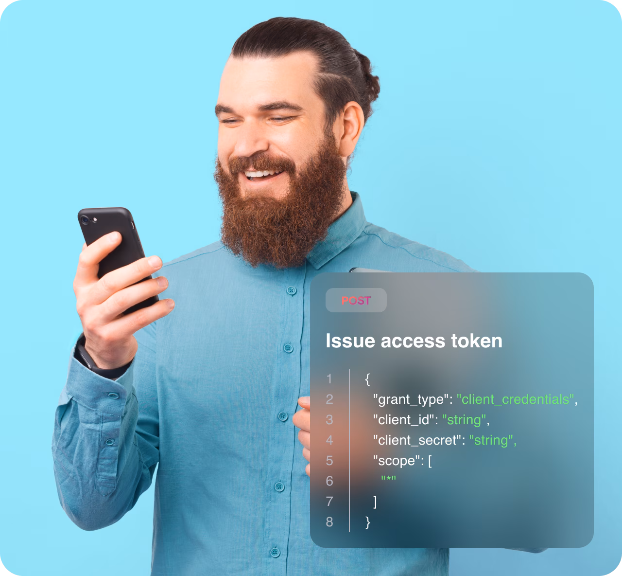 Man in a blue shirt holding a phone