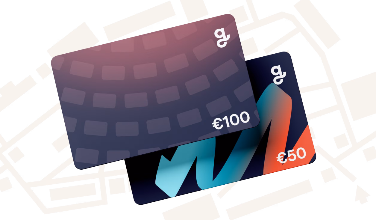 Two Giftify gift cards are shown. One is purple with a grid pattern and a value of €100. The other is dark with a dynamic blend of blue and orange colors, and a value of €50.