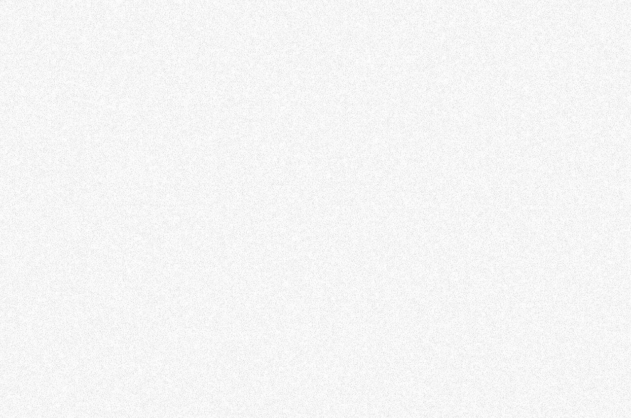 A black and white photo of a textured surface.