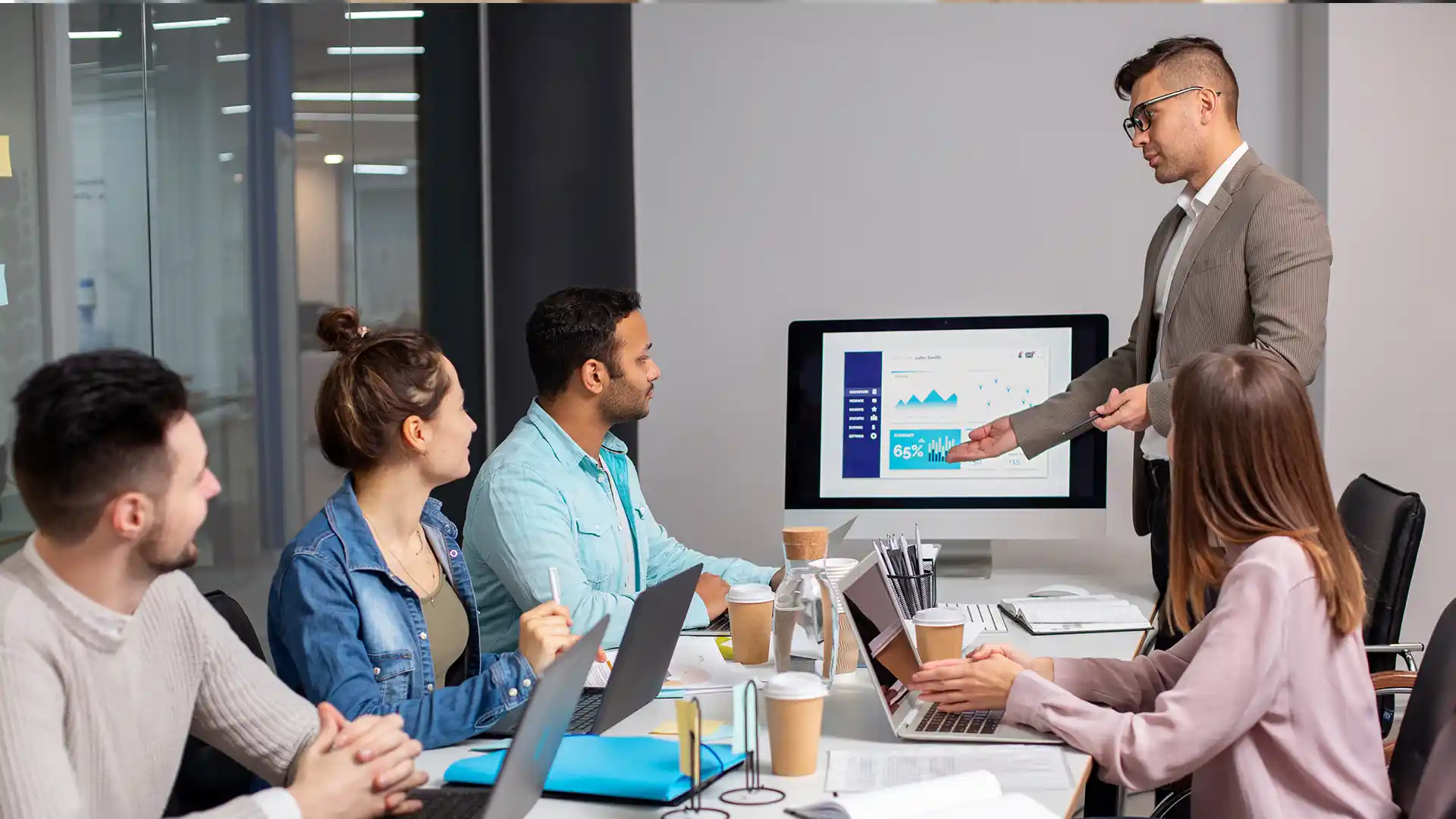 A manager presenting a list of AI benefits to the team.