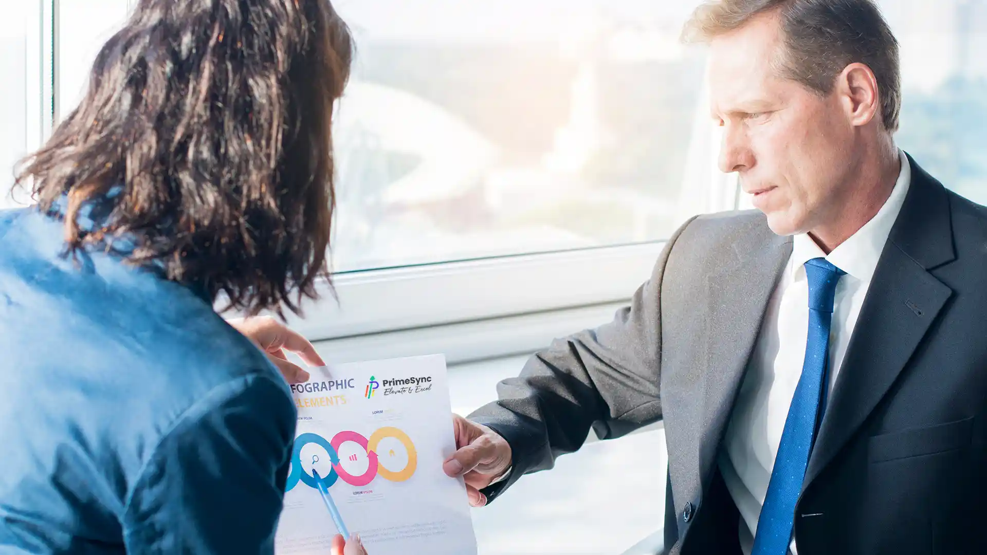 A photo showing a PrimeSync advisor helping a client design a solution.