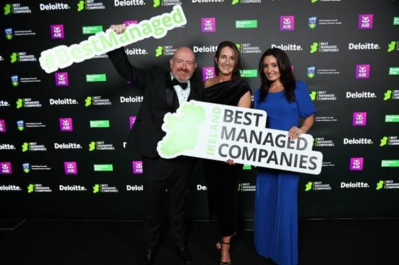 A group of people posing for a photoAI-generated content may be incorrect.