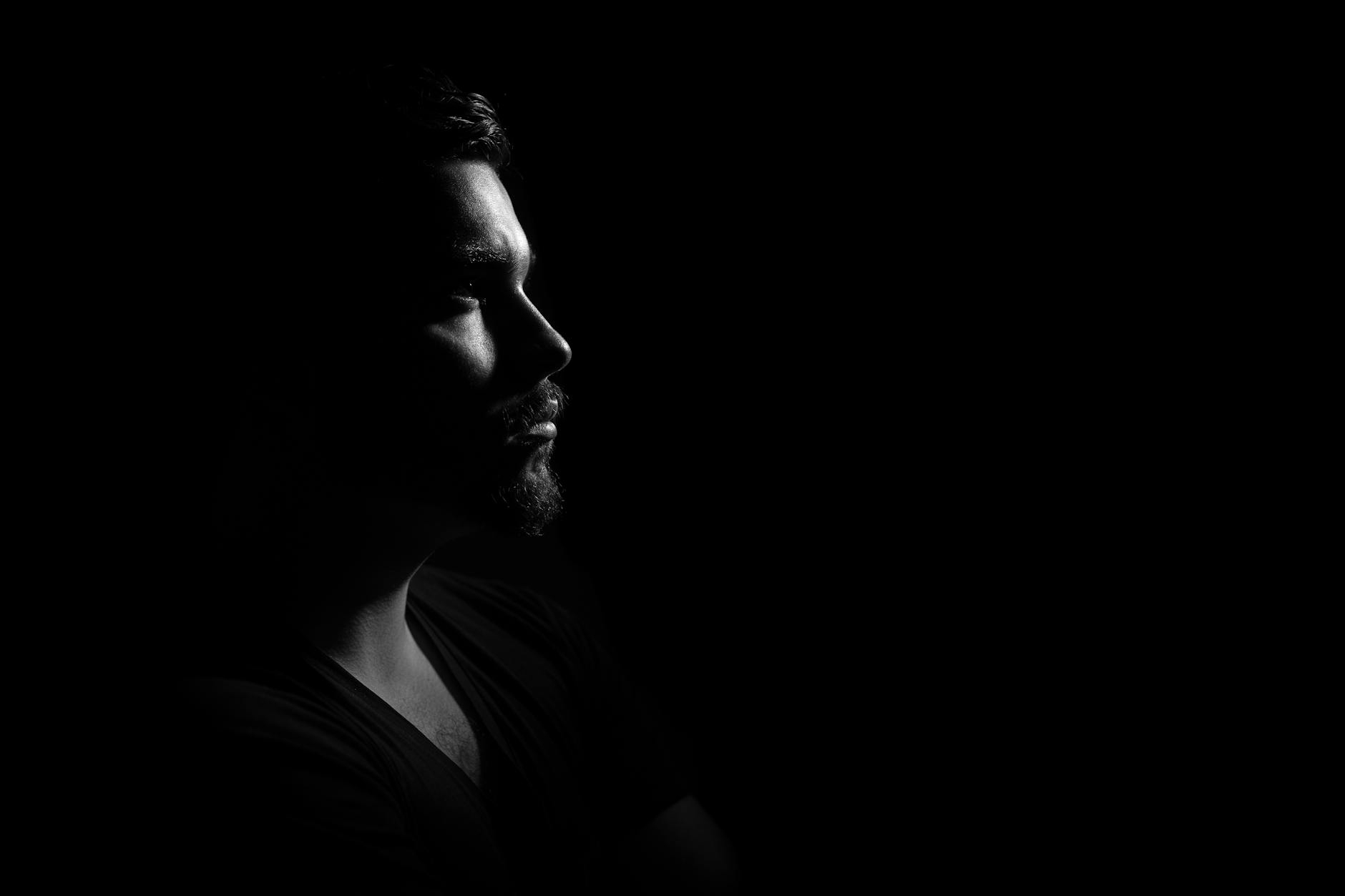 man looking in the dark