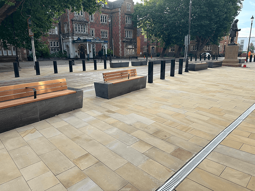 flagged path with benches along the side in stoke city centre