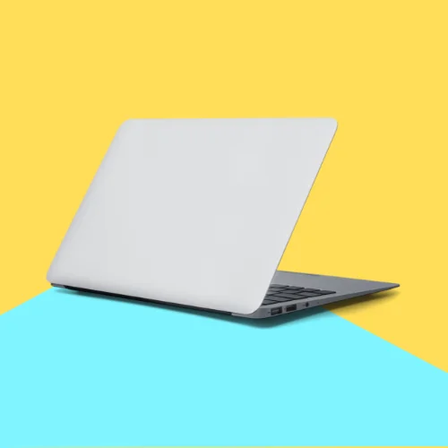 The image features a laptop positioned against a vibrant blue and yellow background. It represents modern technology with elements of design. The tags associated with the image include computer, laptop, notebook, and design.