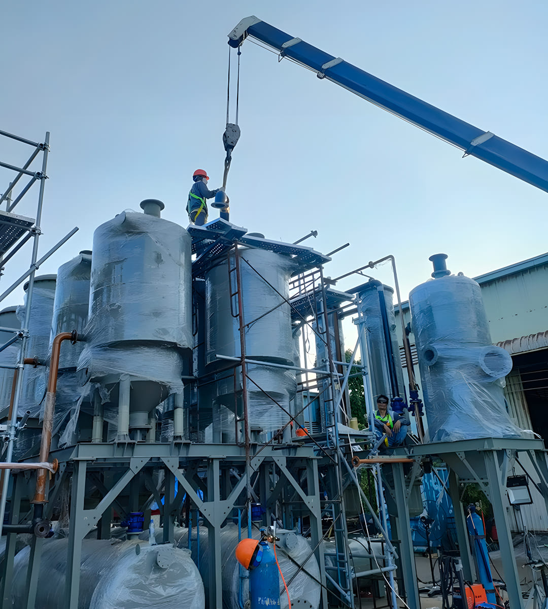 Engineers assembling pyrolysis equipment at CNC M&C facility.