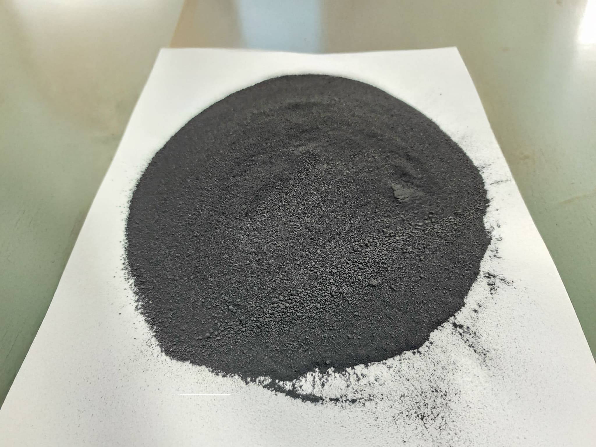 Recovered carbon black powder from tire pyrolysis, a sustainable filler for rubber, plastics, and industrial applications.