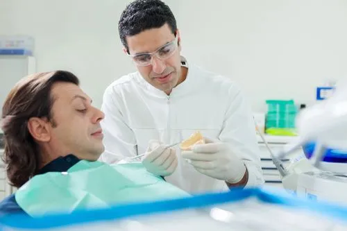 dentist discussing dental implants