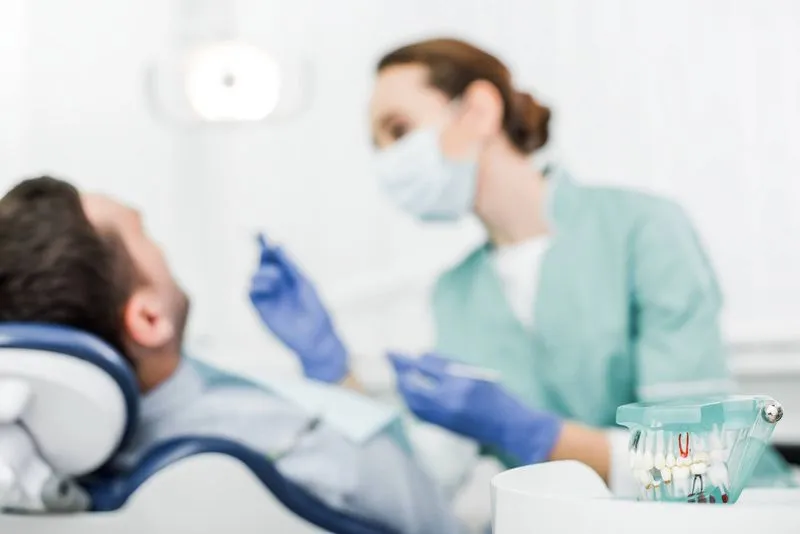 dentist installing dental crowns and bridges