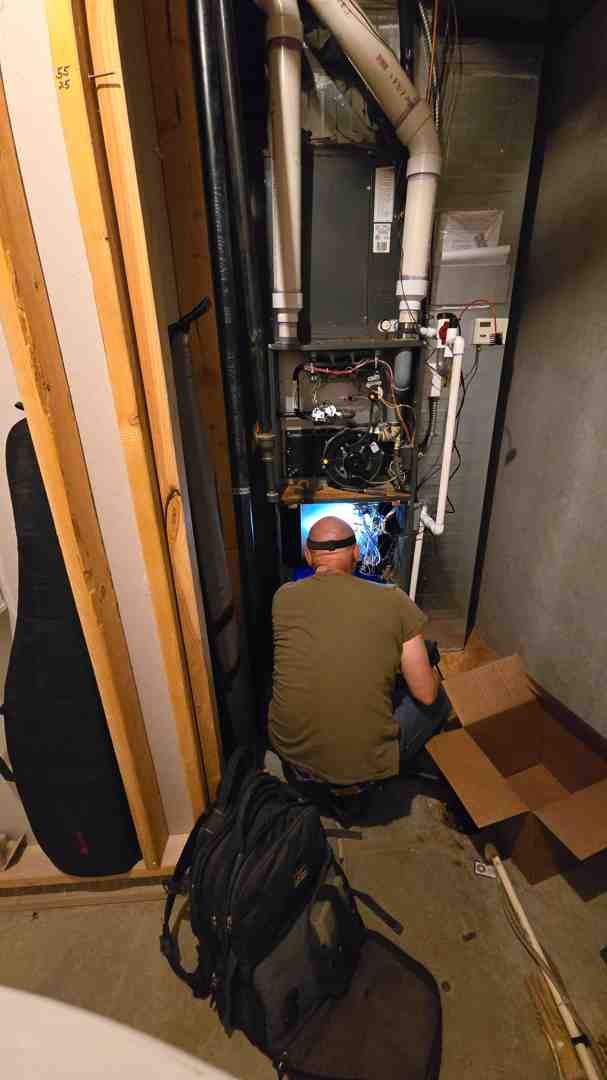 Technician diagnosing a furnace problem - furnace repair lakewood