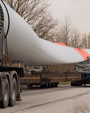 Windmill blade being transported by trailer
