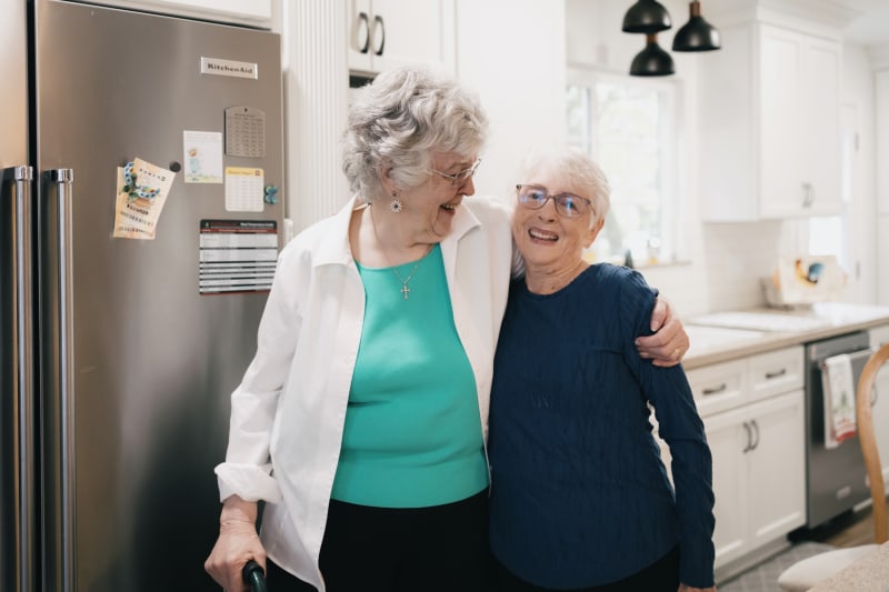 Dental care provider and elderly patient together in modern dental office environment