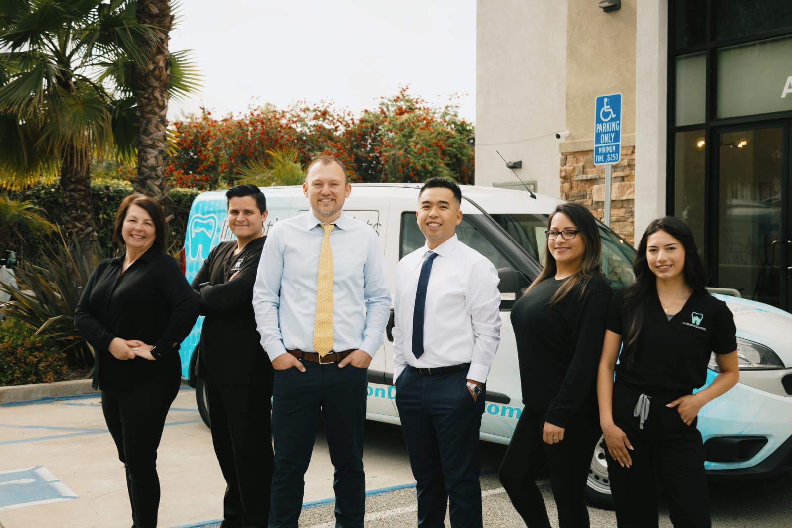 In Motion Dentists team gathered outside office building in La Verne