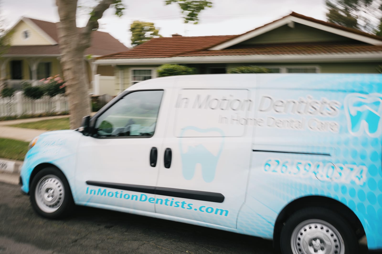 In Motion Dentists mobile van parked at residential home