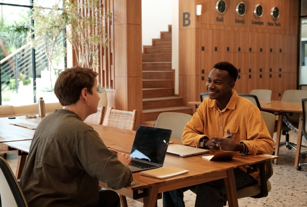 An advisor counsels a young professional