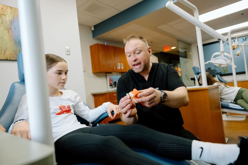 Emergency pediatric dentist treating young patient at Frederick Pediatric Dentistry office