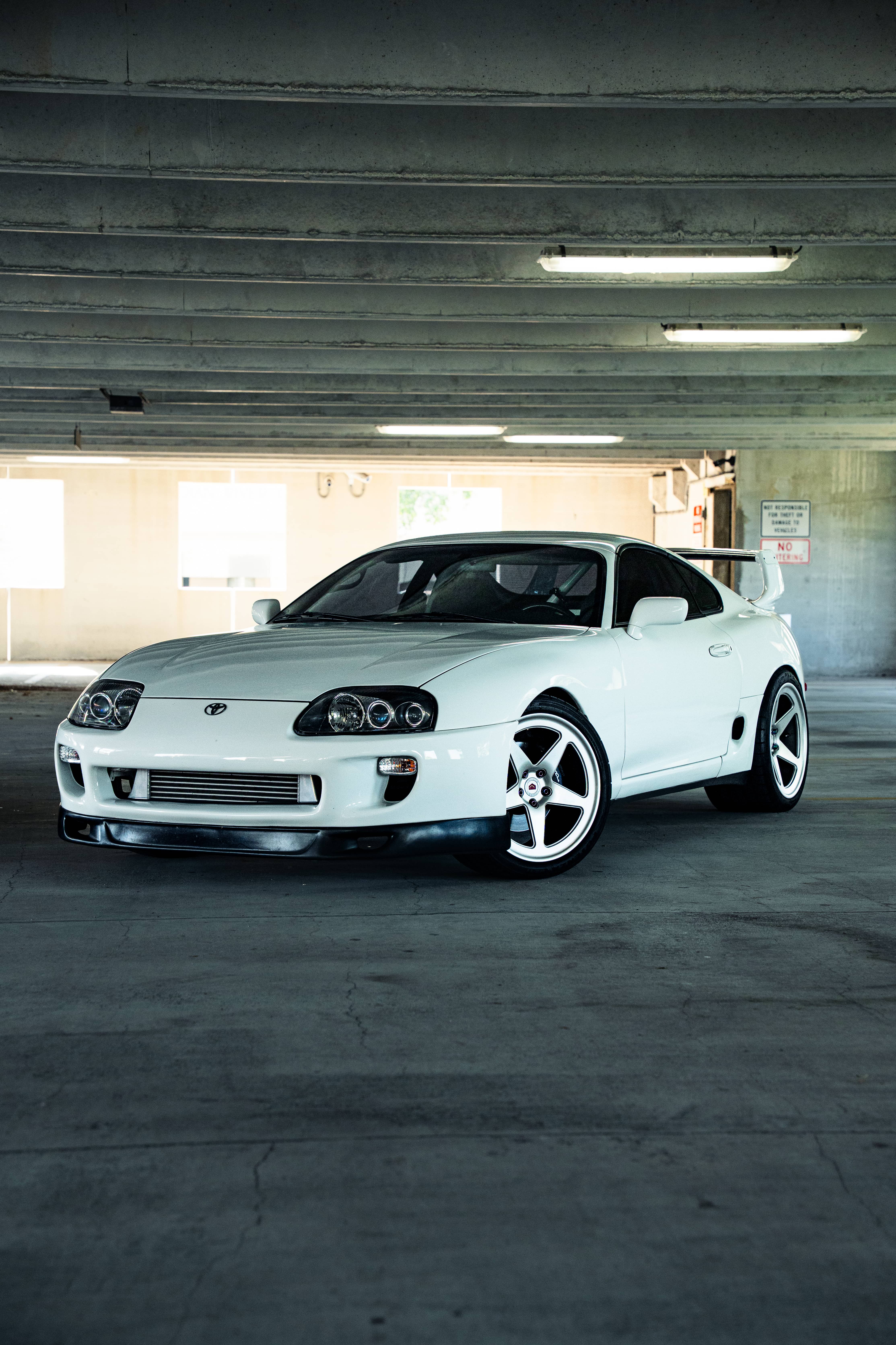 white supra in a parking garage
